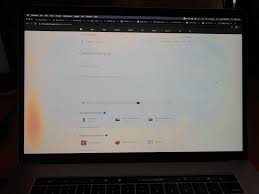 orange spot on MacBook screen